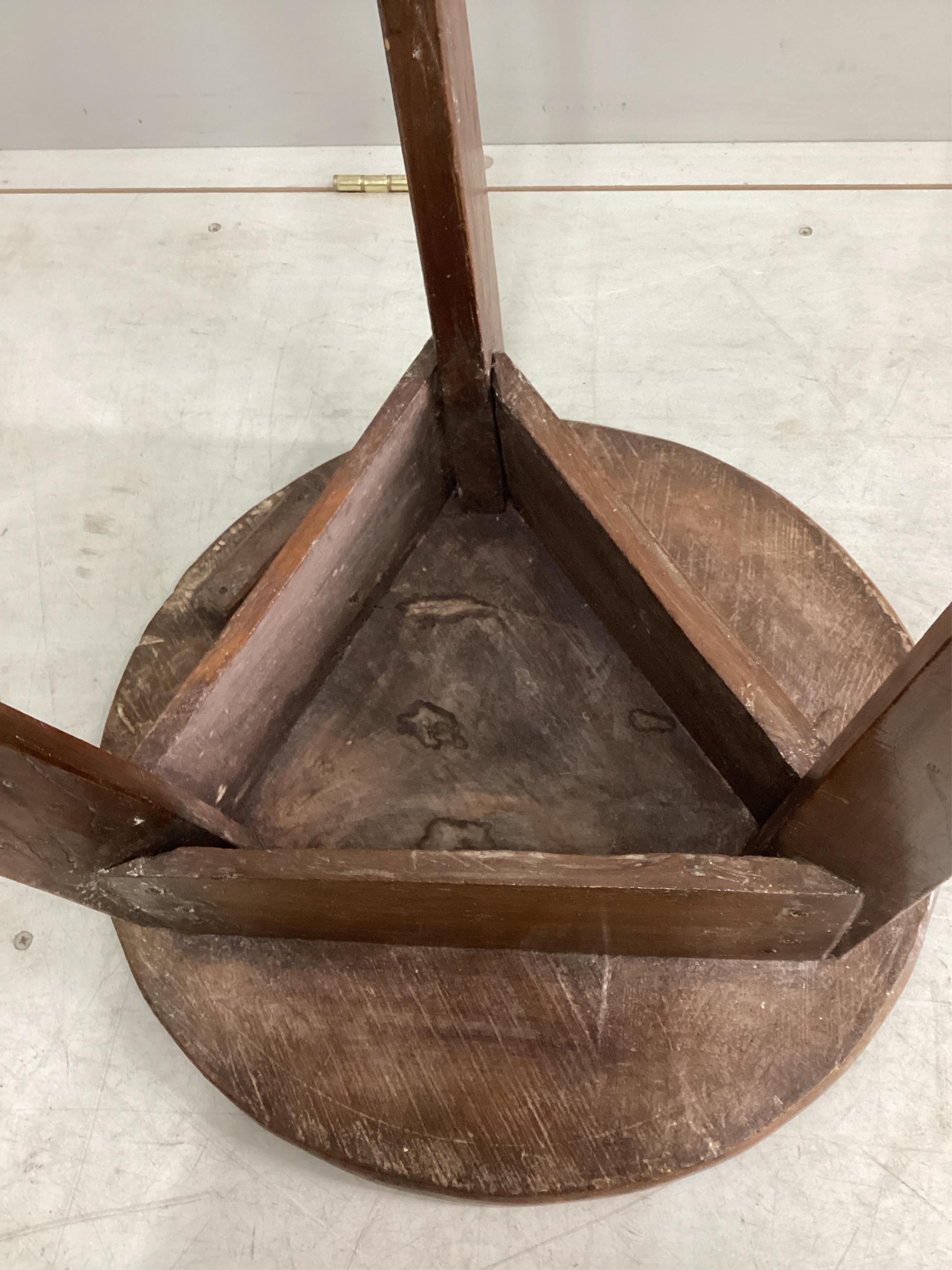 An early 19th century elm and fruitwood cricket table, diameter 46cm, height 66cm. Condition - fair
